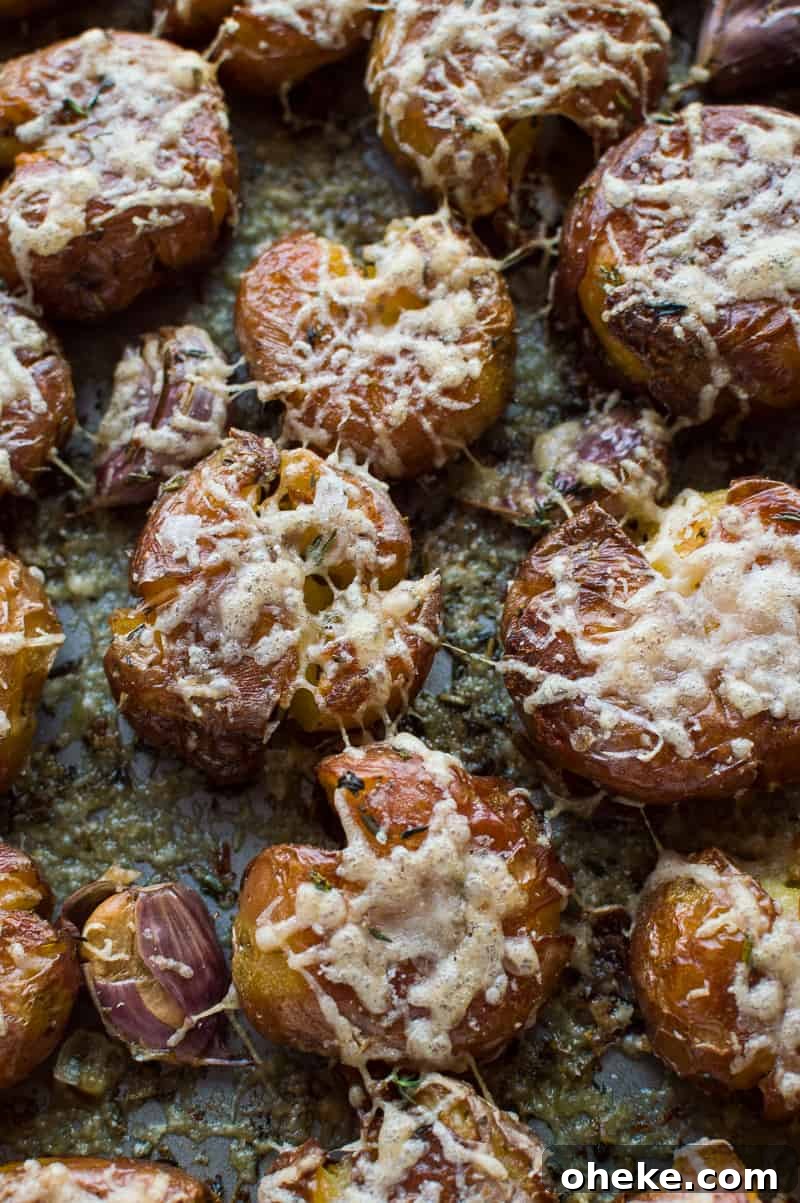 Crispy Herbed Parmesan Smashed Potatoes 6 Herby parmesan smashed potatoes - soft on the inside, crispy on the outside, these are the ultimate side-dish!