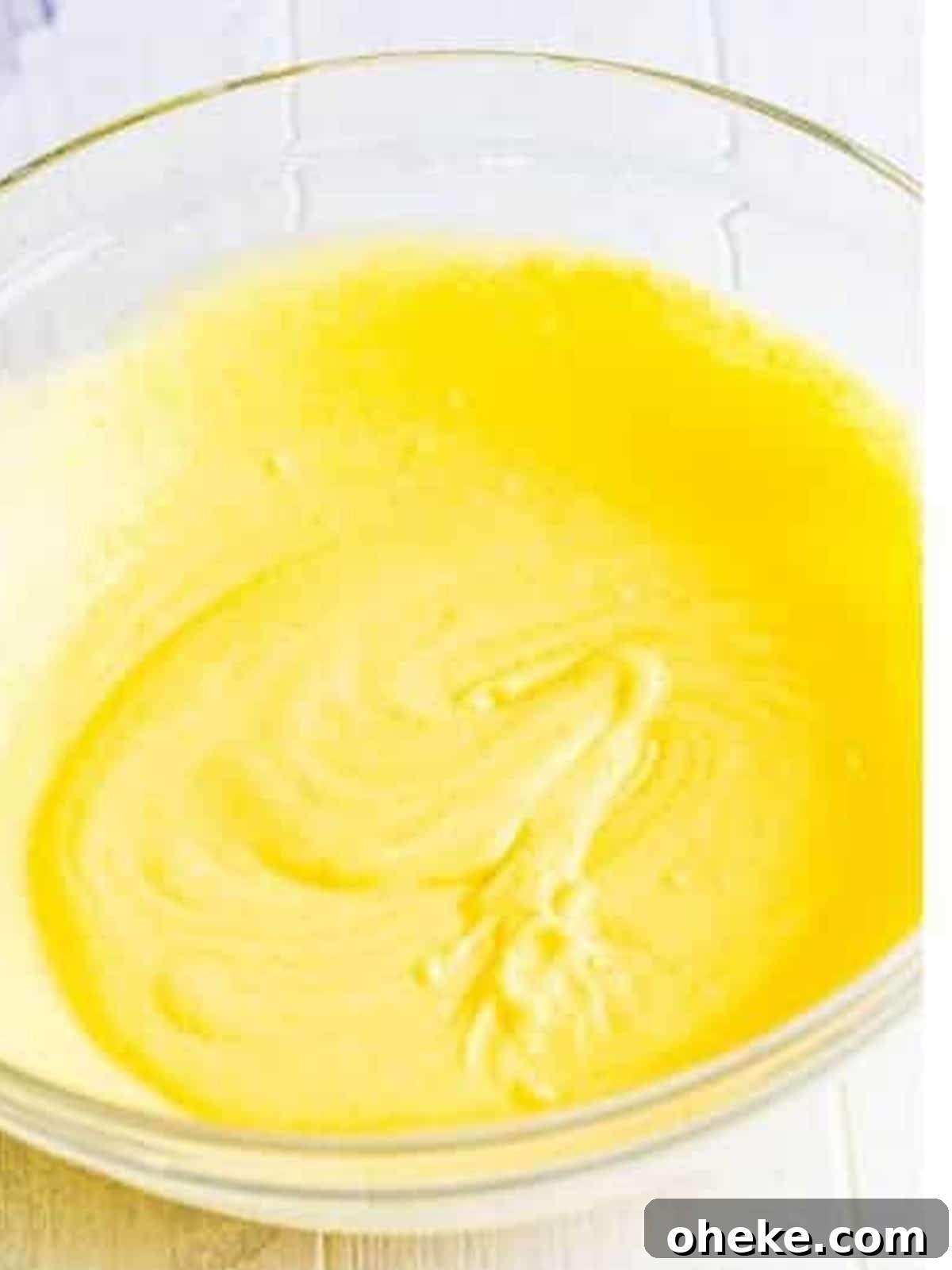 Chocolate Sand Pudding Cups Recipe for Kids' Parties 6 Vanilla pudding whisked with milk in a glass bowl.