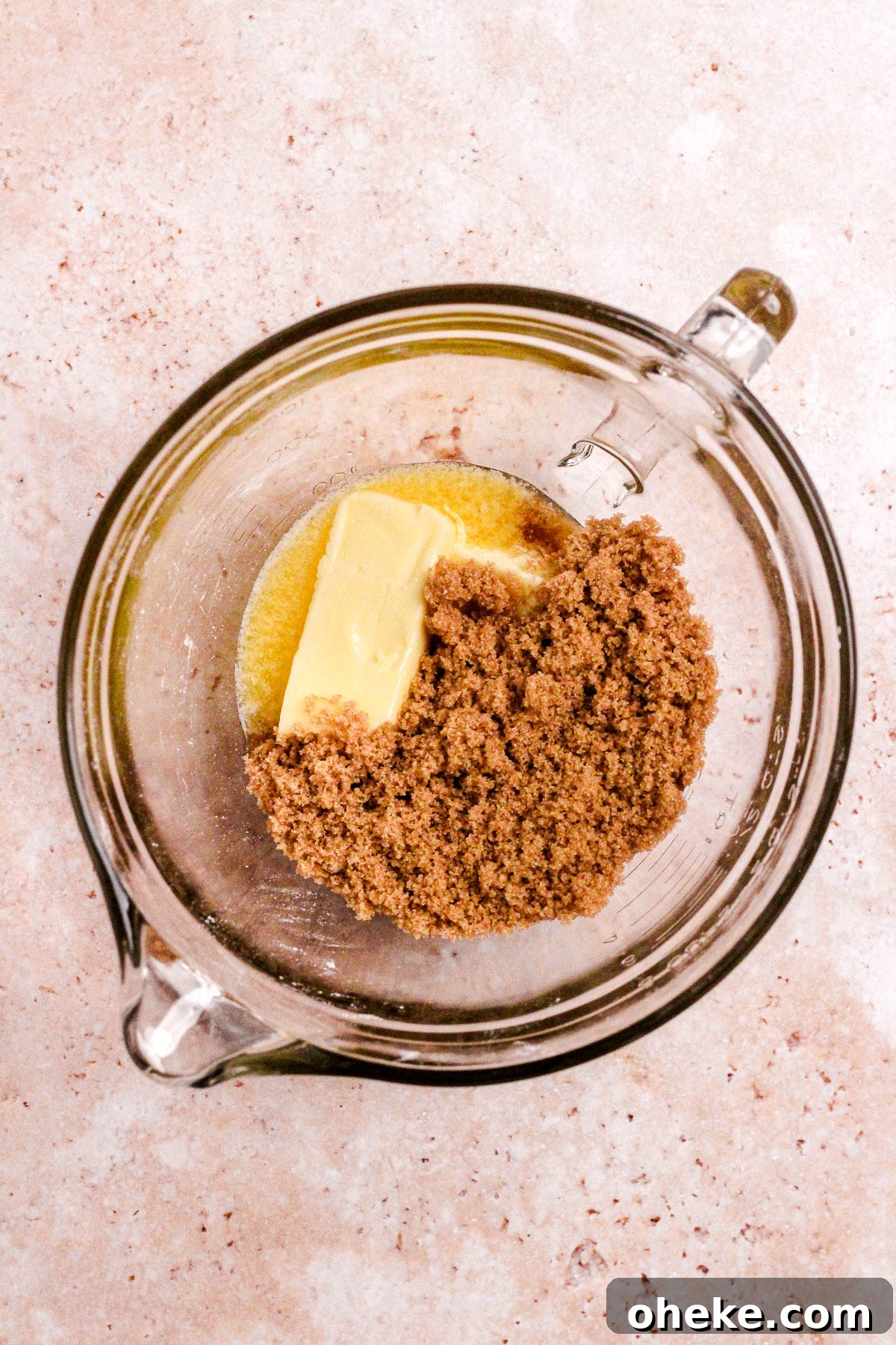 A glass bowl of butter and brown sugar.