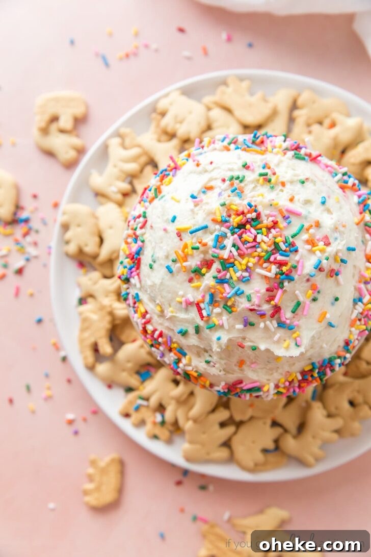 funfetti dip with bowl of rainbow sprinkles and animal crackers