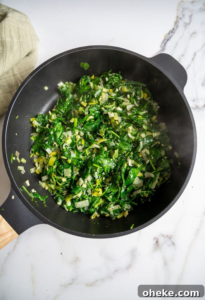 Creamy Baked Spanakopita Dip with Spinach & Feta 8 Sautéing the spinach with the leek, shallots and garlic and spinach.