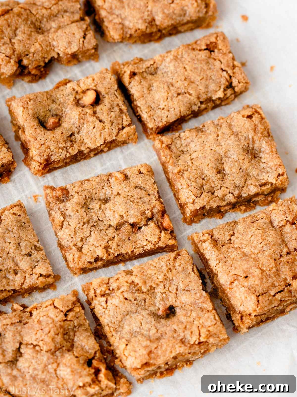 Apple blondies on parchment paper.