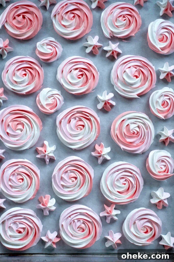 Crispy Meringue Cookies Without Cream of Tartar 14 piped meringue cookies on a parchment lined baking sheet