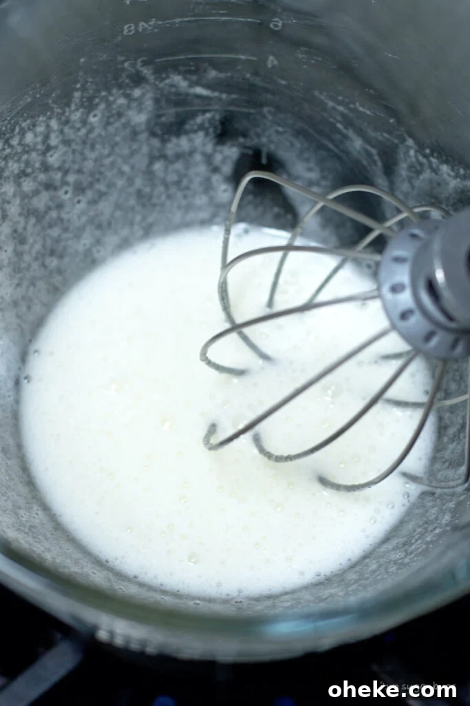 Crispy Meringue Cookies Without Cream of Tartar 7 egg whites and sugar becoming frothy in a double boiler