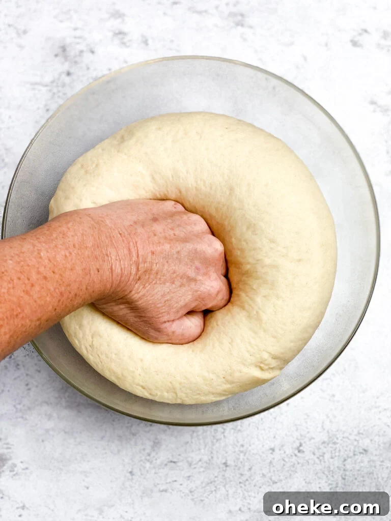 Strawberry Cinnamon Roll Recipe — Soft, Gooey Strawberry Swirls 9 punching down the dough.