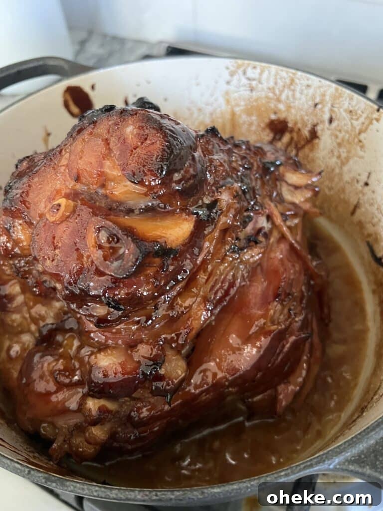 Dutch Oven Spiral Ham with Marsala Glaze Recipe 6 Finished glazed, baked ham in a Dutch oven.