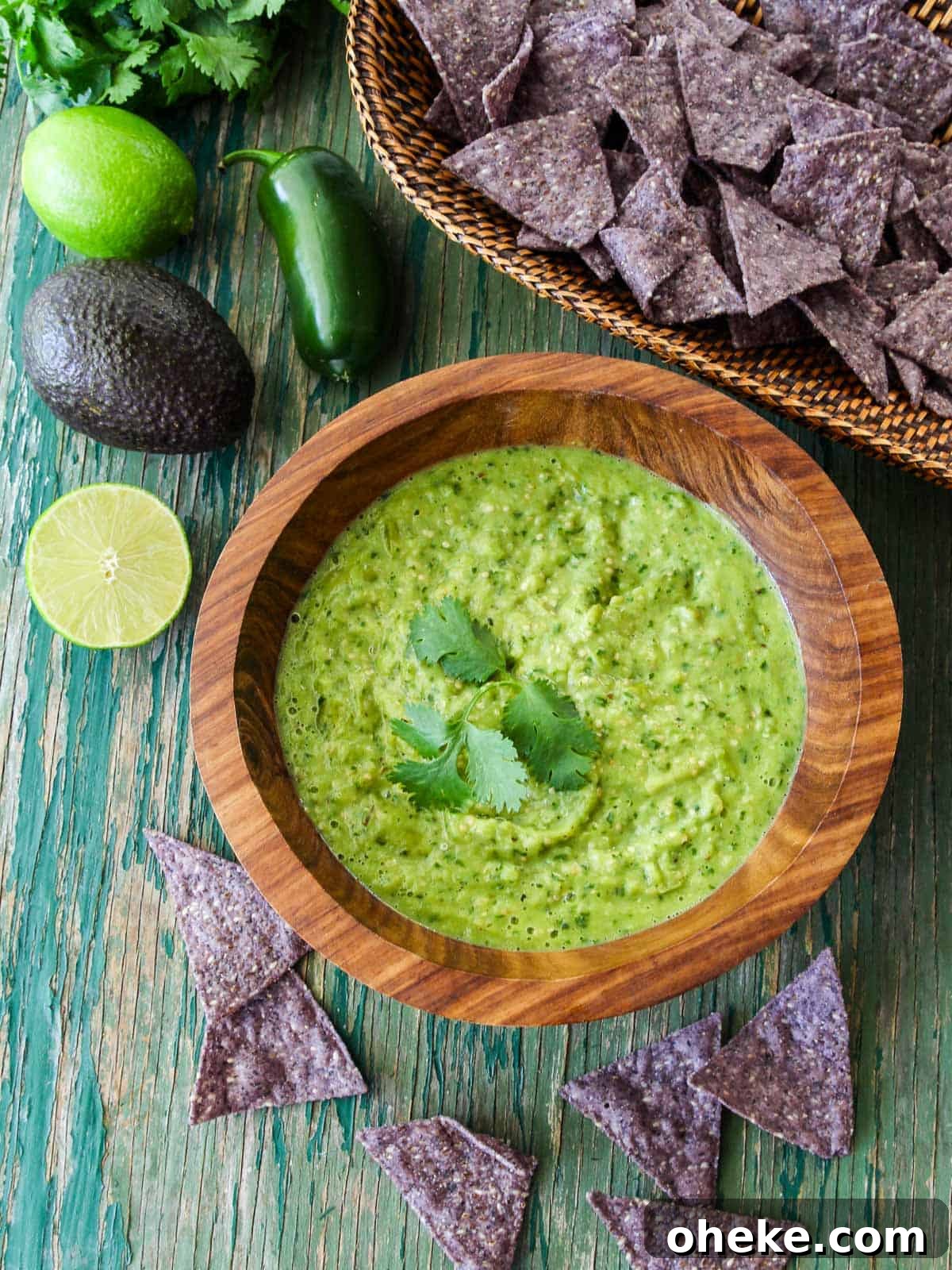 Bowl of avocado salsa with limes