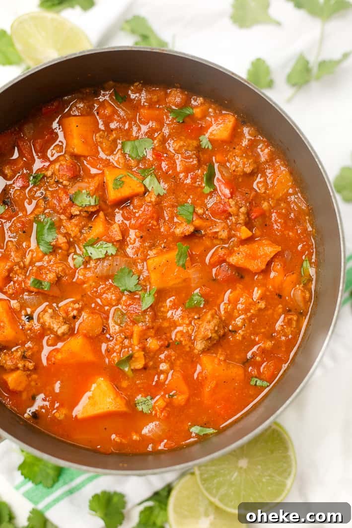 This Paleo sweet potato chili is an easy one-pot dinner recipe with only 8 ingredients! Whole30 approved, can use ground turkey or ground beef. 