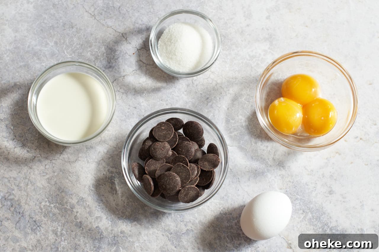 Chocolate Pots de Crème: Simple Stove-Top Method for Rich Dessert 3 One egg and small glass bowls of egg yolks, sugar, chocolate and heavy cream.