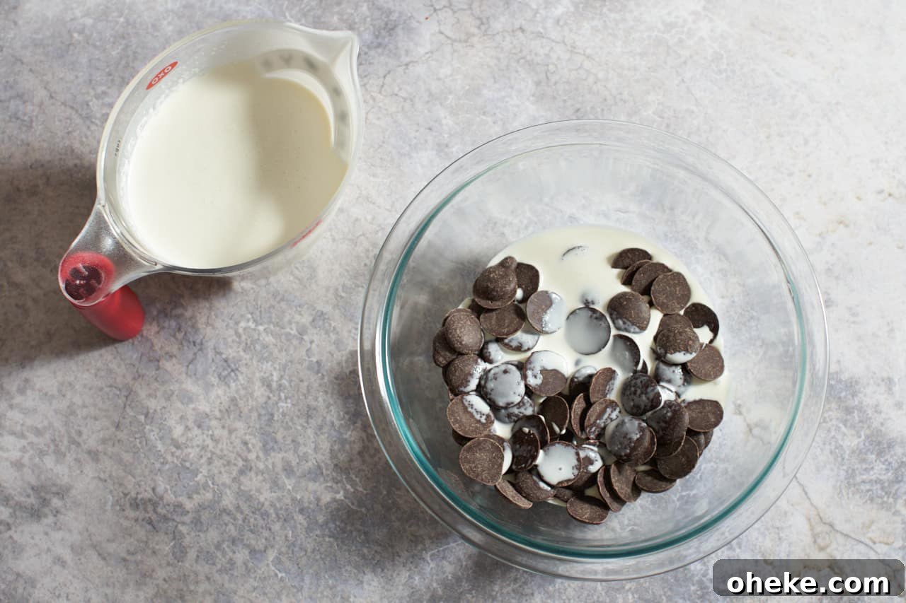 Chocolate Pots de Crème: Simple Stove-Top Method for Rich Dessert 4 A bowl of chocolate wafers and heavy cream. A measuring cup of heavy cream is to the left.
