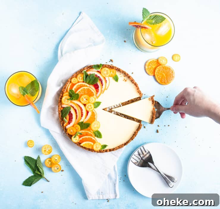 Gluten-Free Gingersnap Tangerine No-Bake Tart Recipe 2 tart with a wedge cut out of the side being removed from the larger tart