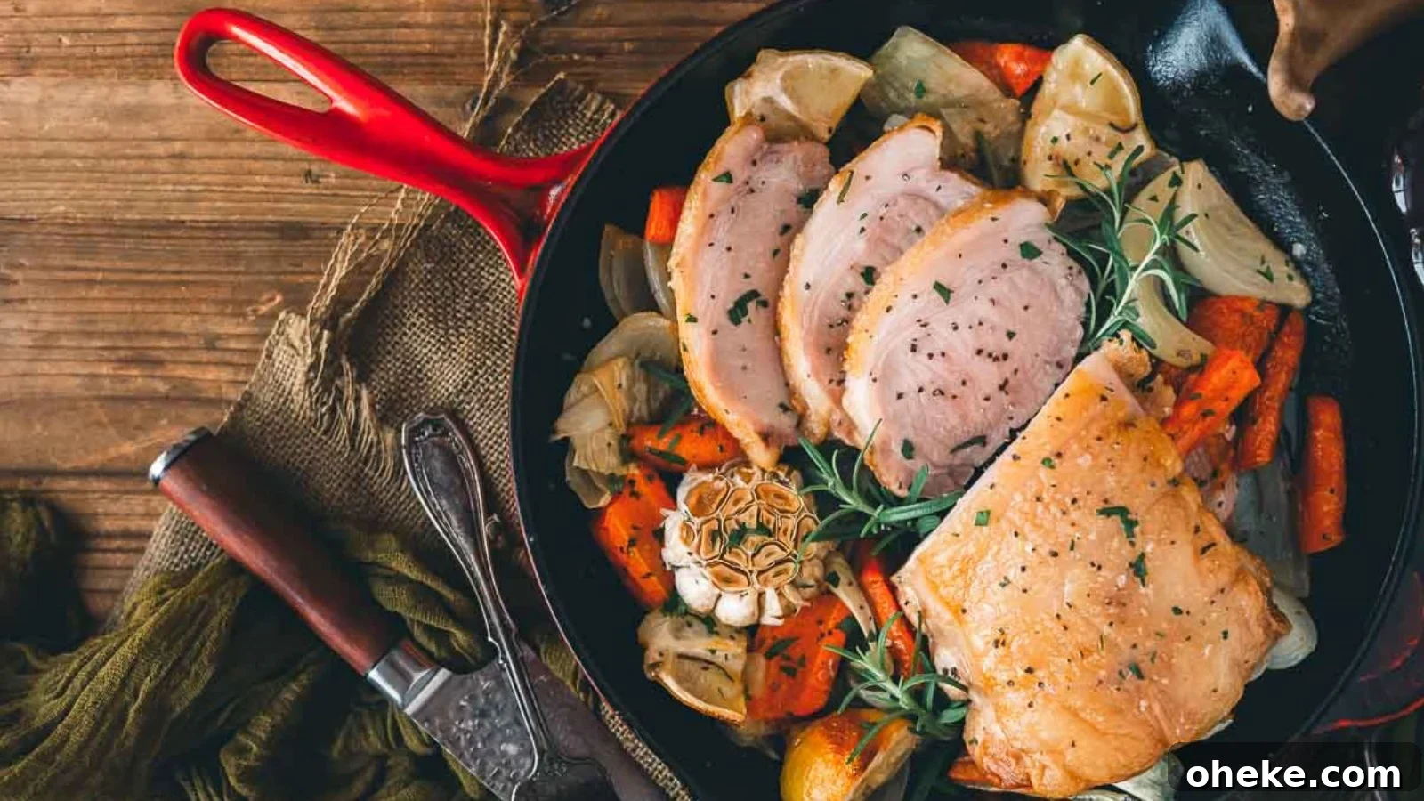 Pork loin roast with a golden crust sliced on a cutting board.