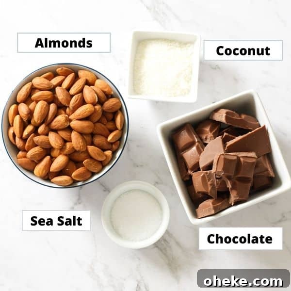Crunchy Chocolate-Covered Almonds Recipe for Homemade Snacks 4 ingredients for chocolate covered almonds on a marble background.