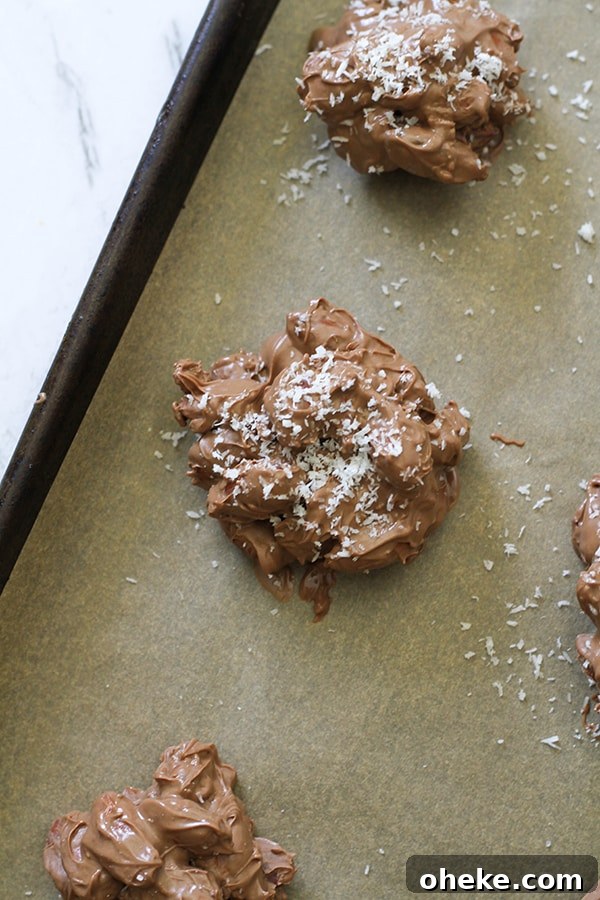 Crunchy Chocolate-Covered Almonds Recipe for Homemade Snacks 9 close up of a chocolate almond cluster on a baking tray