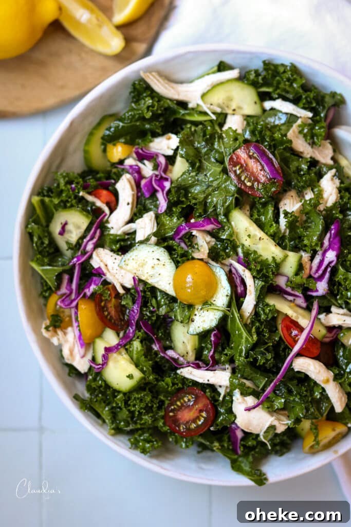 mediterranean kale salad in white bowl on white table