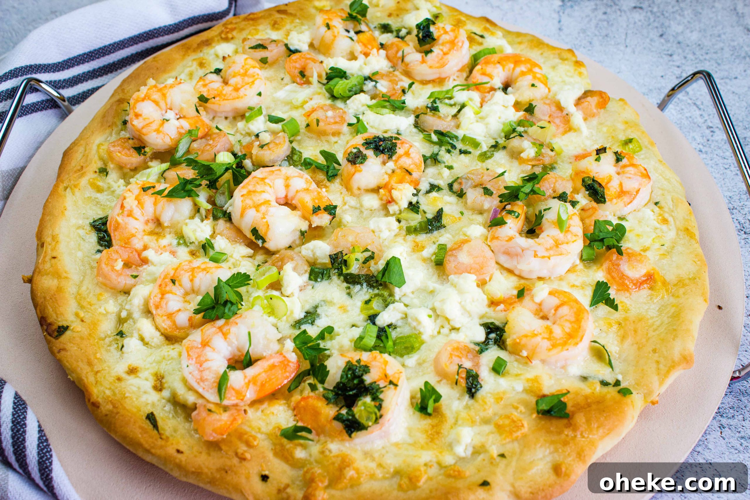 A pizza with shrimp and cheese on top.