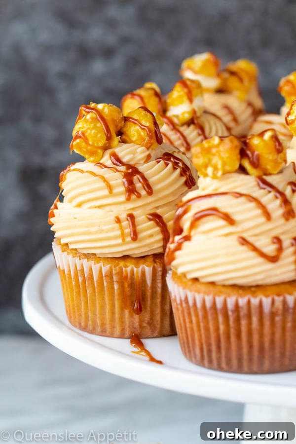 caramel popcorn flavoured cupcakes on a white cake stand