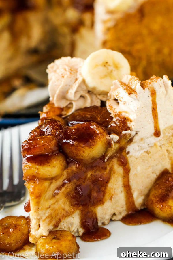 slice of banana cheesecake topped with bananas foster
