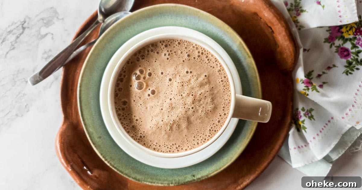17 Comforting Recipes to Keep You Warm This Season 17 A picture of bone broth coffee late in white mug with overhead view.