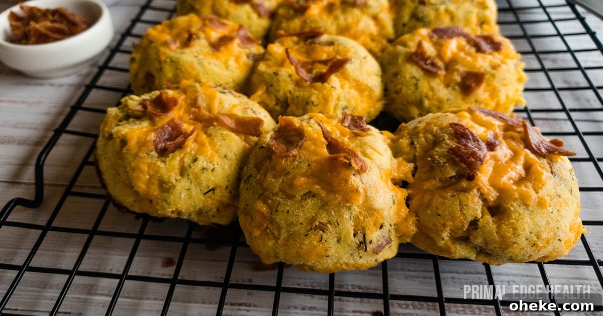 17 Comforting Recipes to Keep You Warm This Season 18 A picture of biscuits with bacon and cheese on top cooling on rack.