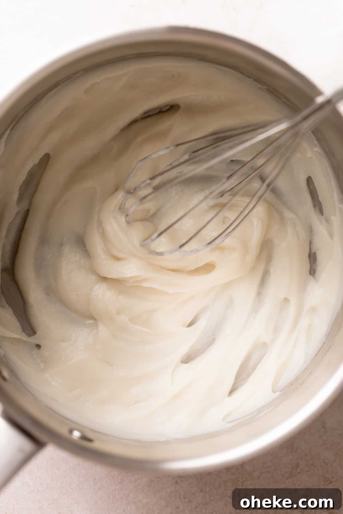 Cookies and Cream Cinnamon Rolls Recipe for Dessert Lovers 3 Tangzhong mixture in a pot being whisked.
