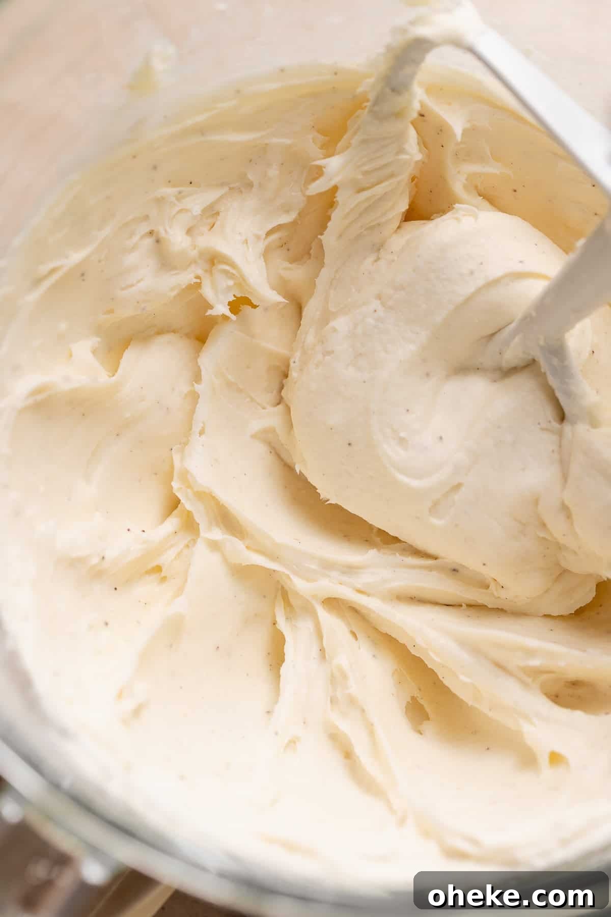 Cookies and Cream Cinnamon Rolls Recipe for Dessert Lovers 9 Cream cheese frosting in a mixing bowl.