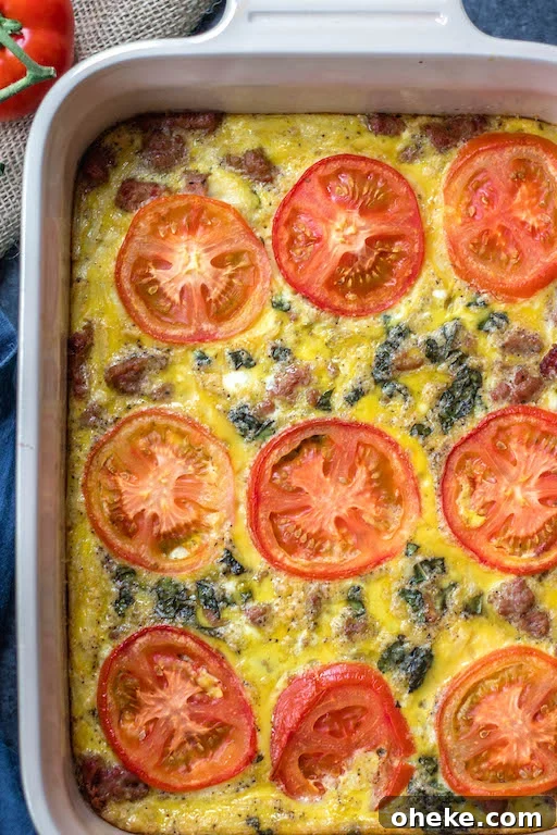 This Whole30 breakfast casserole is filled with sausage, tomato, basil and potatoes, and couldn't be easier to whip up for a Whole30 or Paleo breakfast meal prep recipe.