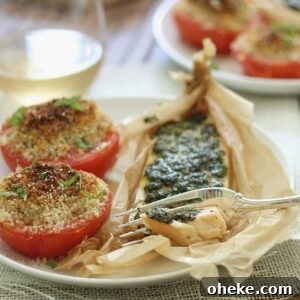 Parchment baked pesto salmon with basil tomatoes.