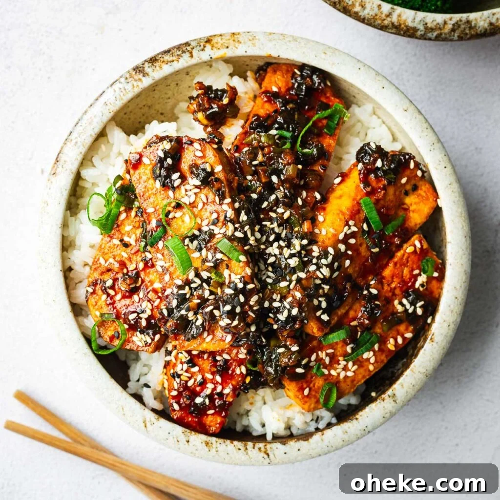 Spicy Gochujang Korean Noodles Recipe 16 A rice bowl with extra-firm tofu pan-fried and braised in a spicy gochujang sauce.
