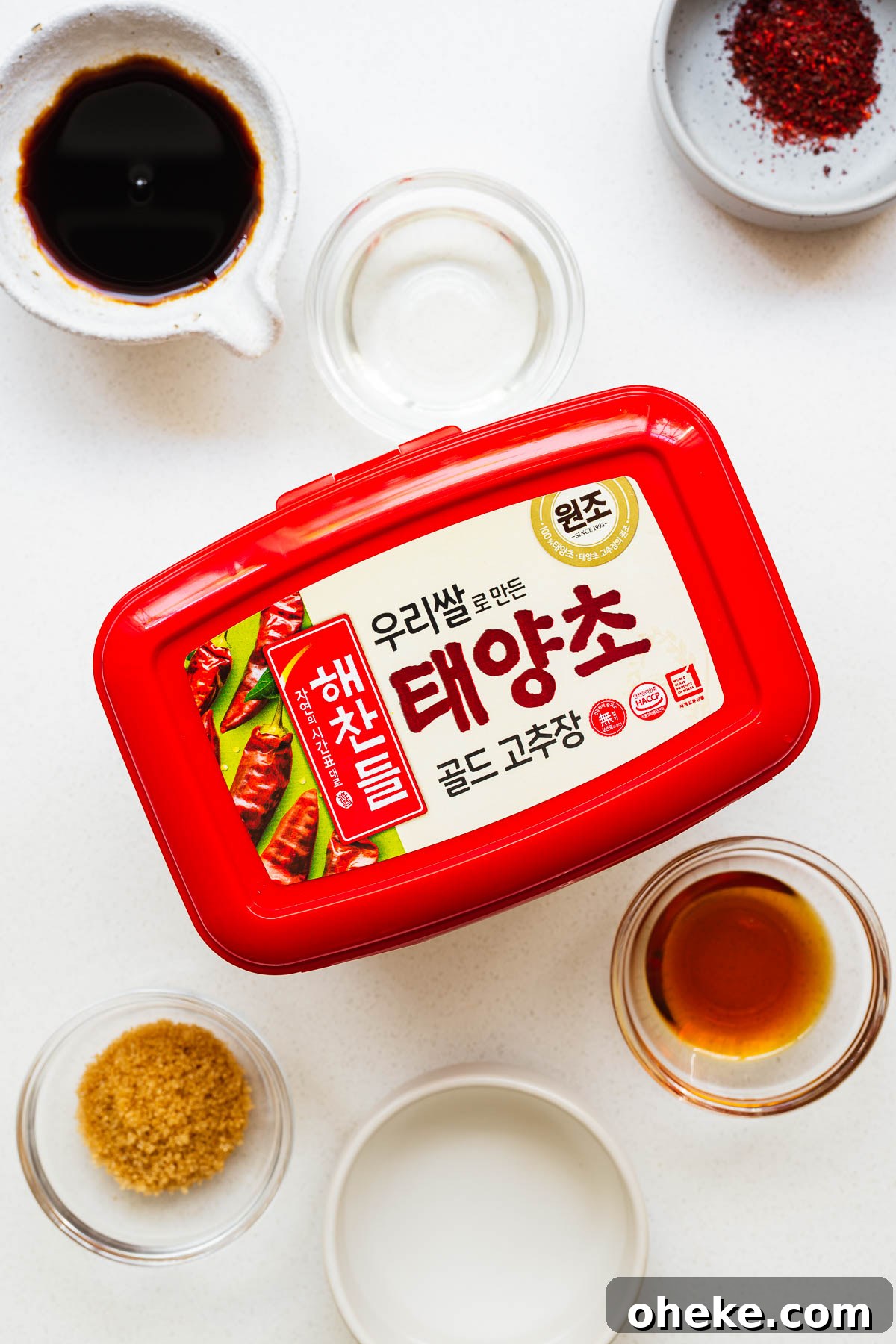 Spicy Gochujang Korean Noodles Recipe 4 Ingredients for gocuhjang noodle sauce arranged on a kitchen counter.