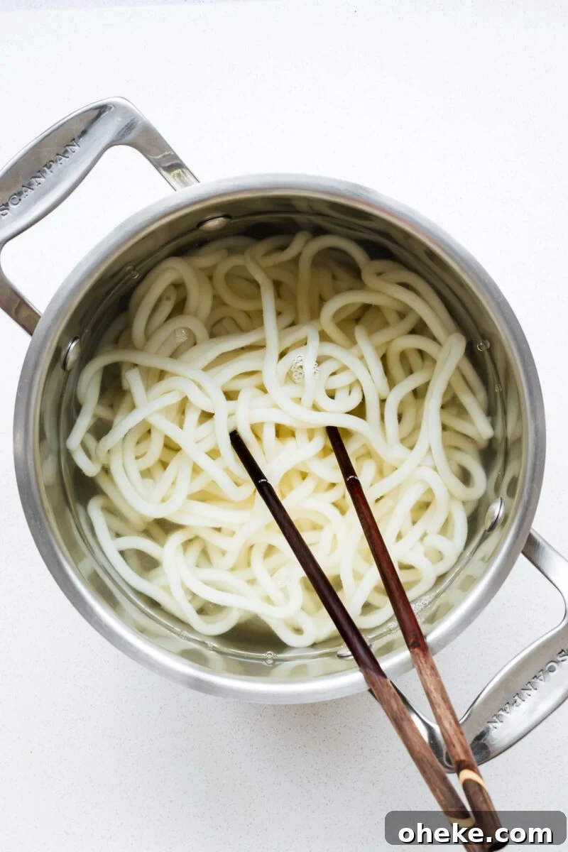 Spicy Gochujang Korean Noodles Recipe 7 Cook udon noodles in a pot then use chopsticks to separate the noodles.