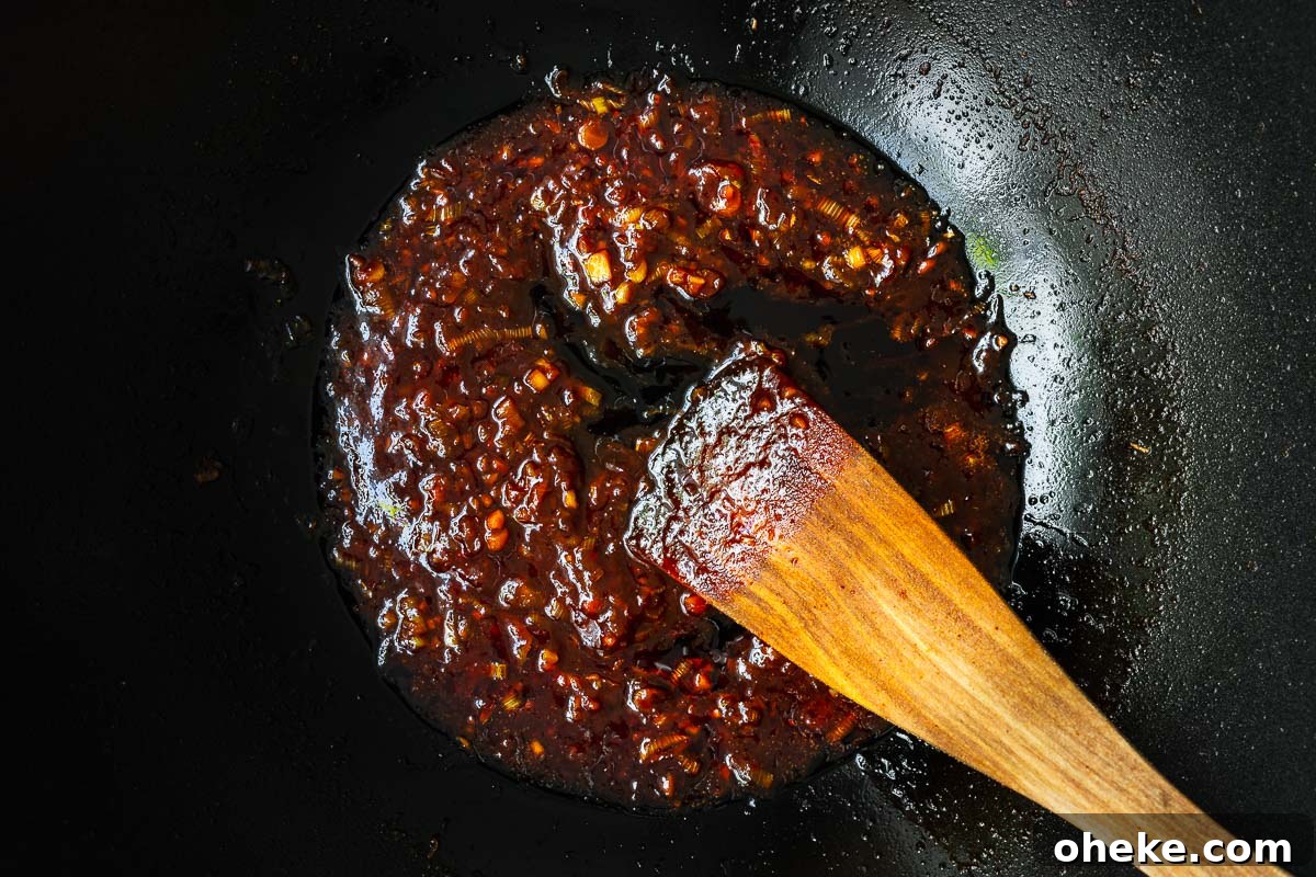 Spicy Gochujang Korean Noodles Recipe 9 Gochujang noodle sauce in a wok.