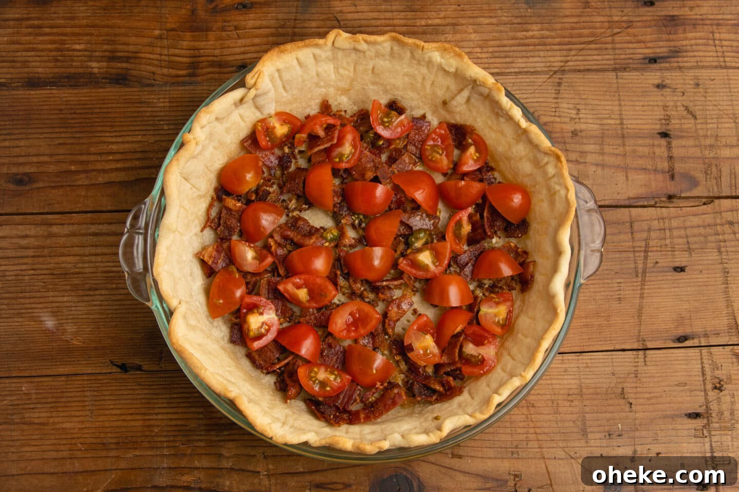 This is a picture of the crust with tomatoes added.