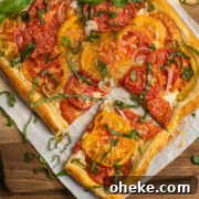 This is a square picture of the goat cheese tomato puff pastry tart.