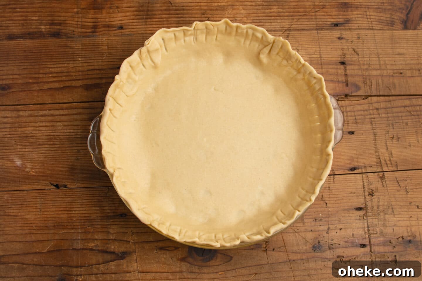 This is a picture of the crust in a pie dish.