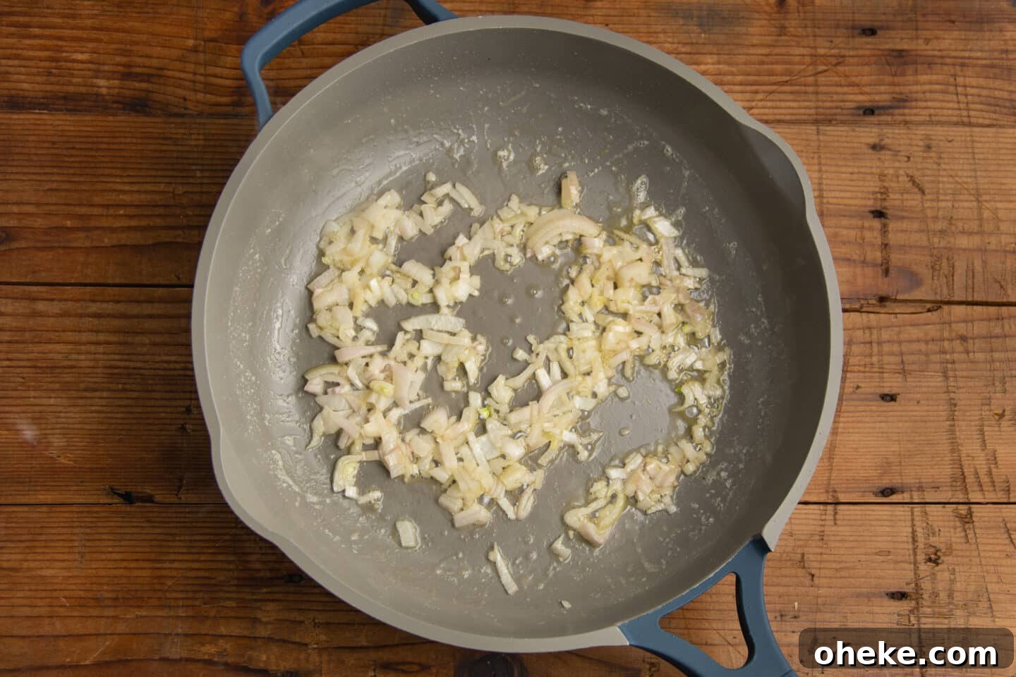 This is a picture of a skillet with shallots being caramelized.