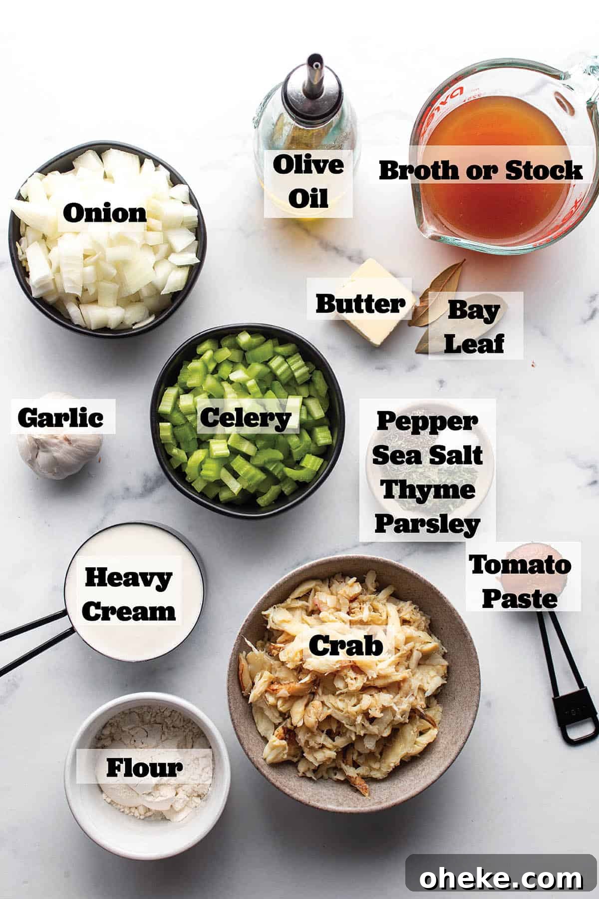 Ingredients laid out in prep bowls and measuring cups for a crab bisque.