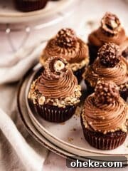 chocolate cupcakes with nutella frosting topped with ferrero rocher chocolate