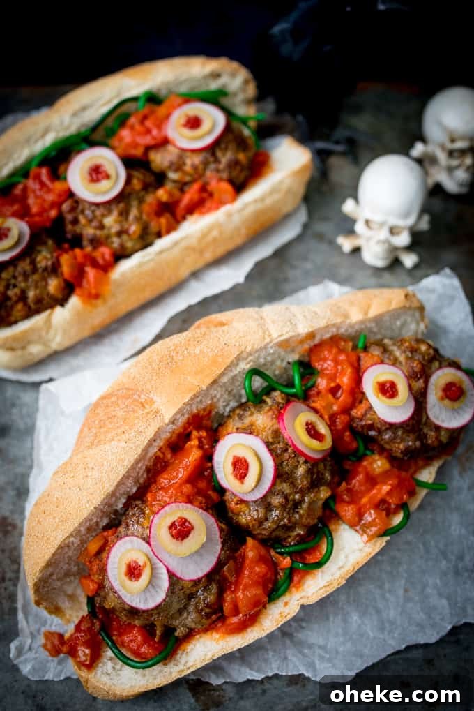 Spooky Halloween Eyeball Sub Sandwich Recipe 2 Halloween Eyeball Sub on a dark background with skulls in the background