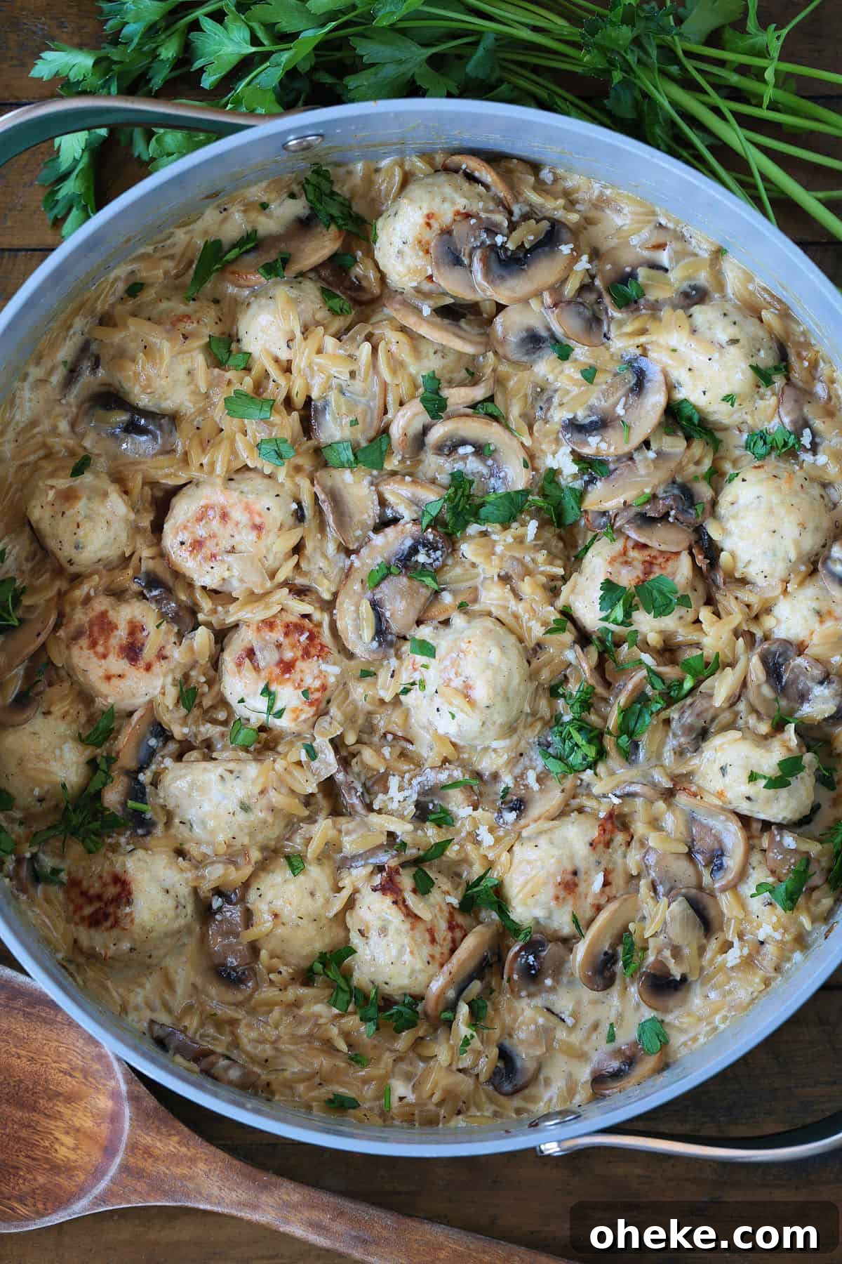skillet with mushroom orzo and chicken meatballs