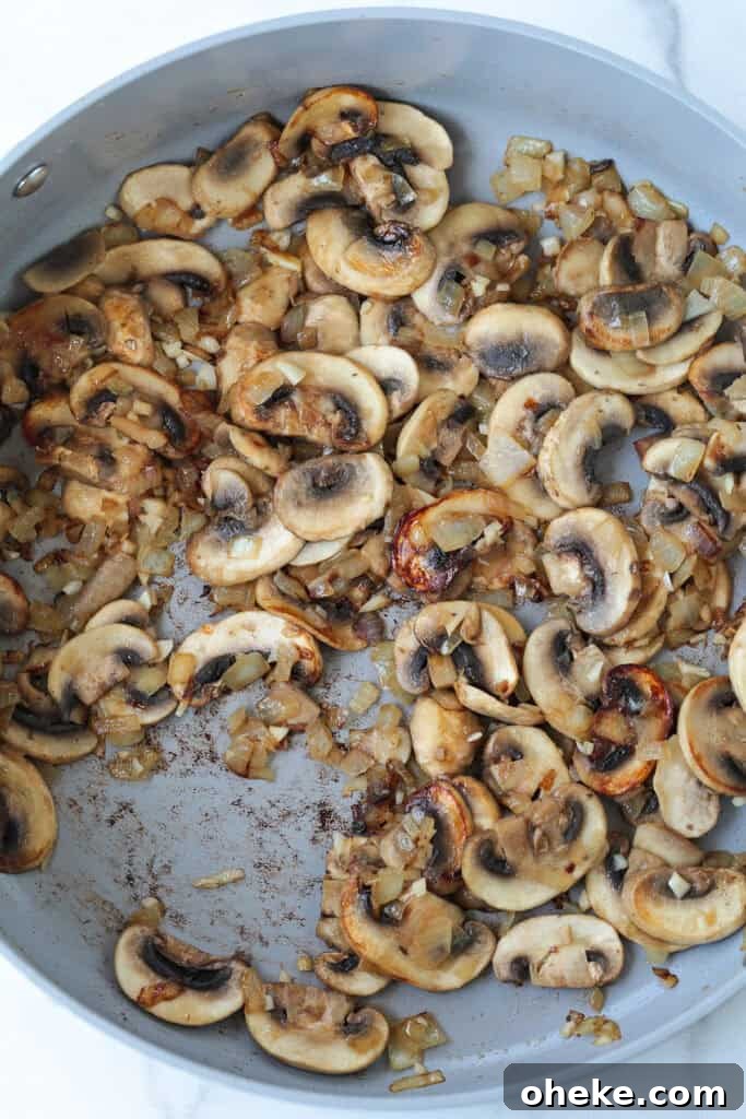 sliced mushrooms browning in skillet