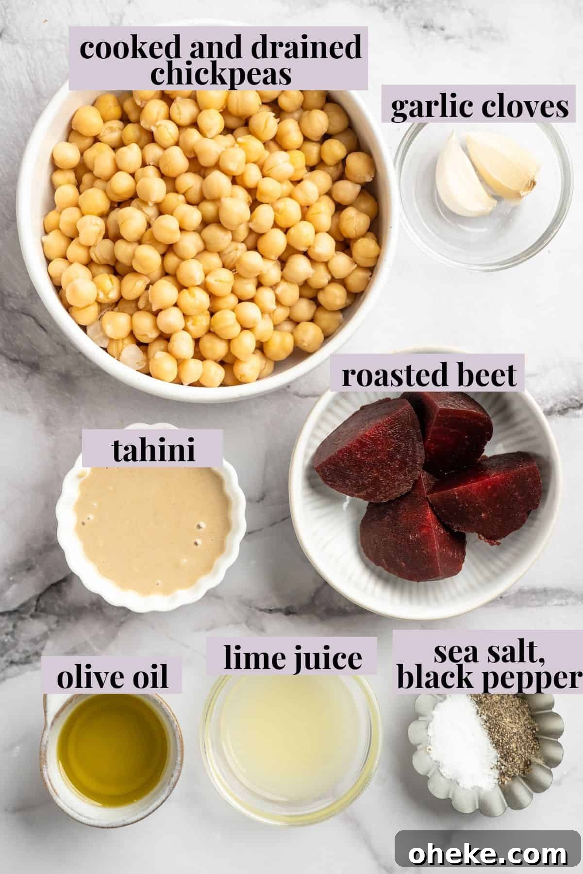 Roasted beets make this creamy Beet Hummus extra delicious—and give it the prettiest pink colour. It's easy to make and always a hit! Overhead view of ingredients for beet hummus