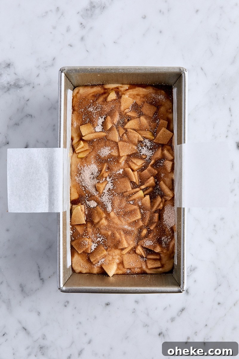 Spiced Apple Fritter Loaf: Cinnamon Apple Bread Recipe 14 Cinnamon sugar sprinkled over the top of unbaked apple fritter bread