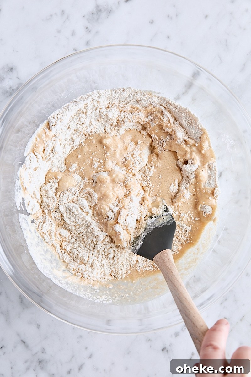 Spiced Apple Fritter Loaf: Cinnamon Apple Bread Recipe 8 Folding apple cider mixture into flour mixture with a rubber spatula