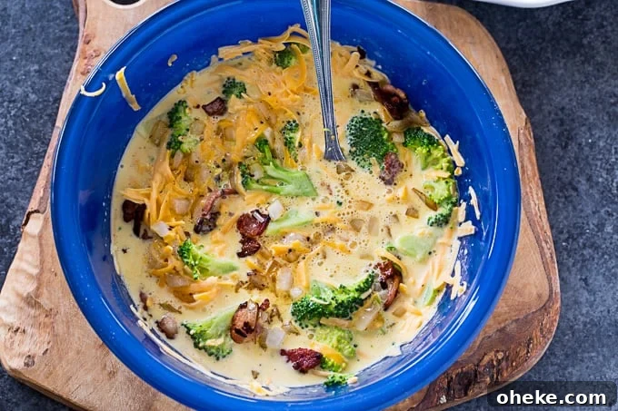 Crustless Broccoli and Cheddar Quiche - Low Carb Recipe 4 Crustless Broccoli Cheddar Quiche (Low Carb) filling in bowl