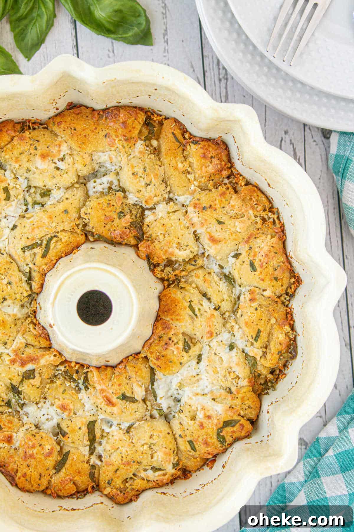 Savory Garlic Pull-Apart Bread Recipe 2 Overhead close up view of an Italian Monkey bread in a bundt pan.