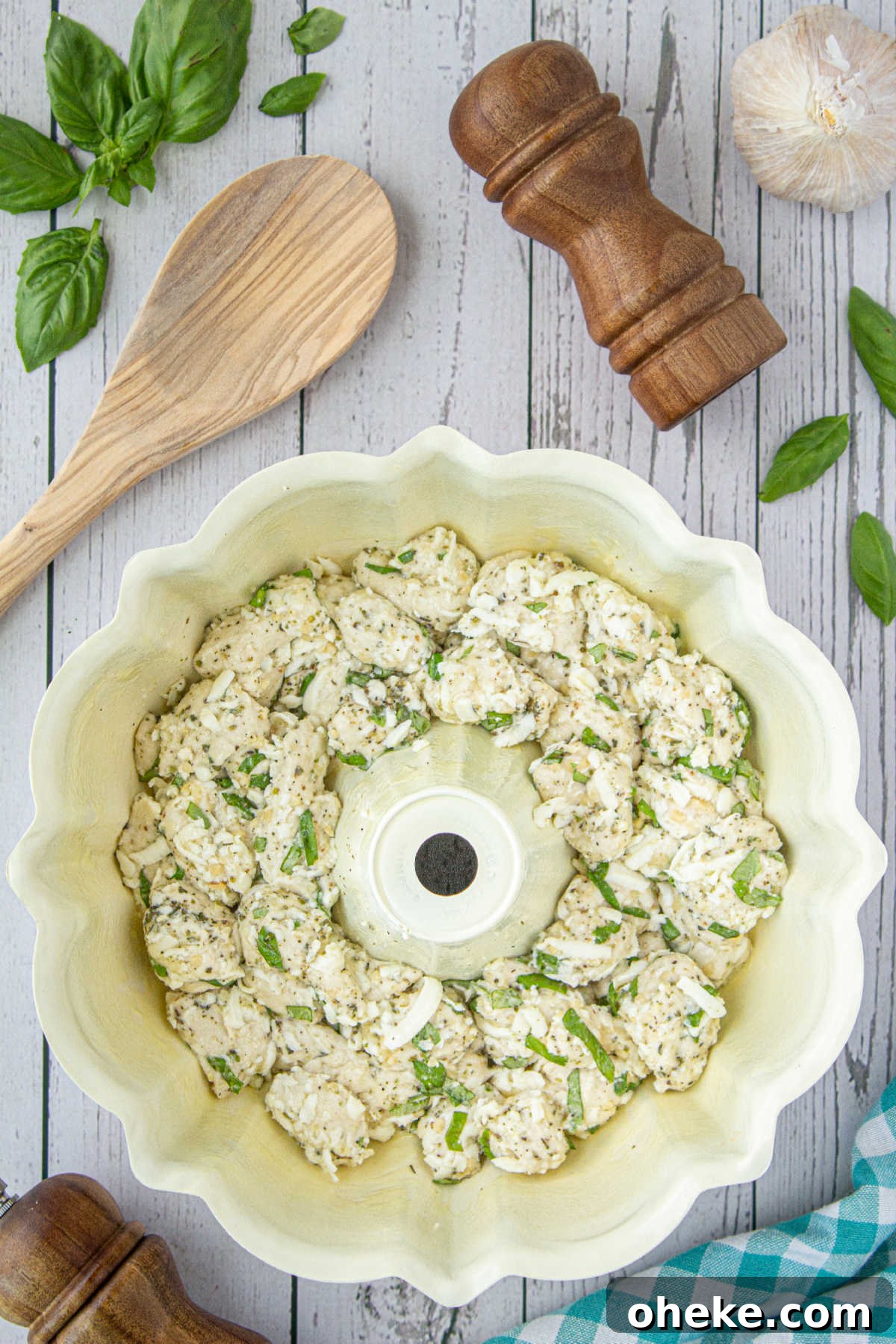 Savory Garlic Pull-Apart Bread Recipe 7 A bundt pan filled with refrigerated biscuit dough, cheese and seasonings.