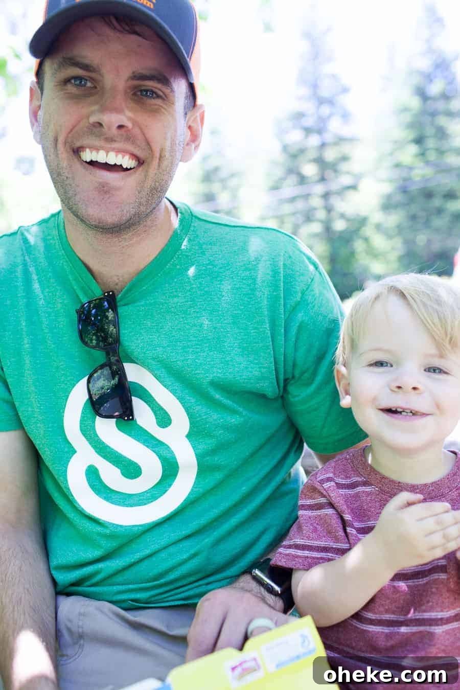 Creating Lasting Memories with Your Toddler: Fun Activities & Tips 11 Making Memories with a Toddler - A man and a child smiling while holding a box of cookies.
