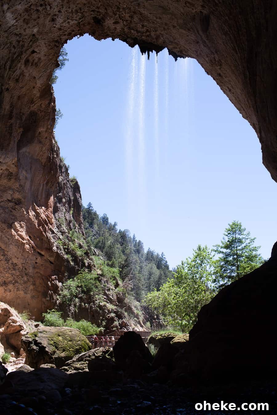 Creating Lasting Memories with Your Toddler: Fun Activities & Tips 4 A cave with a mesmerizing waterfall, perfect for making memories with a toddler.