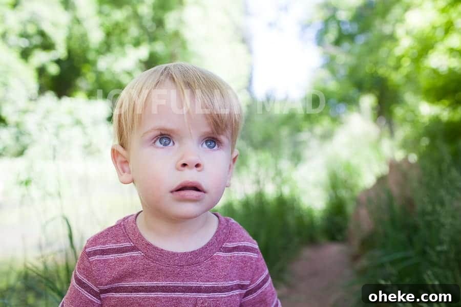 Creating Lasting Memories with Your Toddler: Fun Activities & Tips 5 A young toddler is staring into the distance, making memories with a sense of wonder.